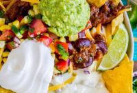 Stacked Chili Nachos with Molten Queso and Fresh Guacamole
