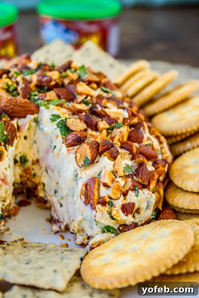 Sriracha Almond Asian Cheese Delight 6 A vibrant platter featuring the Asian Cheese Ball surrounded by fresh dippers.
