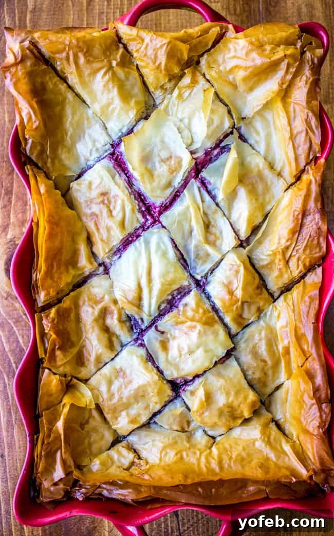Decadent Berry Cheesecake Baklava 7 A slice of homemade Berry Cheesecake Baklava