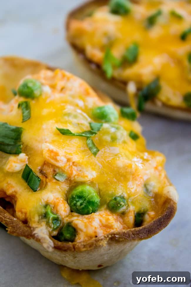 Loaded Buffalo Chicken Boats 11 Finished Cheesy Buffalo Chicken Boats garnished with green onions