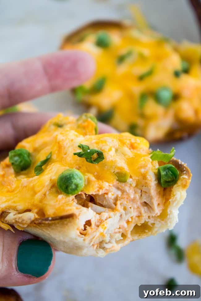 Loaded Buffalo Chicken Boats 5 Top-down view of Cheesy Buffalo Chicken Boats, showing the vibrant filling and golden crust