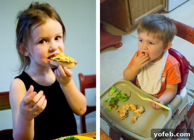 Loaded Buffalo Chicken Boats 10 A child happily eating a Cheesy Buffalo Chicken Boat, posing for the camera