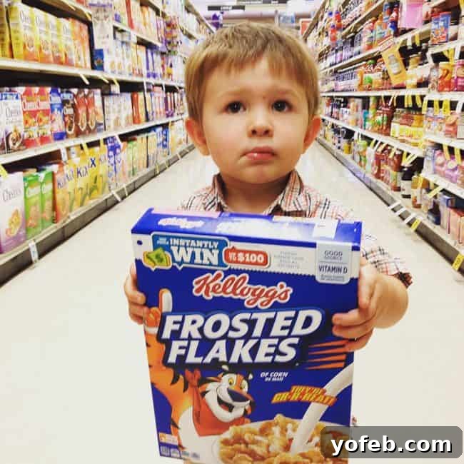 Zesty Basil Pesto Chicken 3 Adorable toddler happily holding a box of cereal, symbolizing the simple joy of having food.