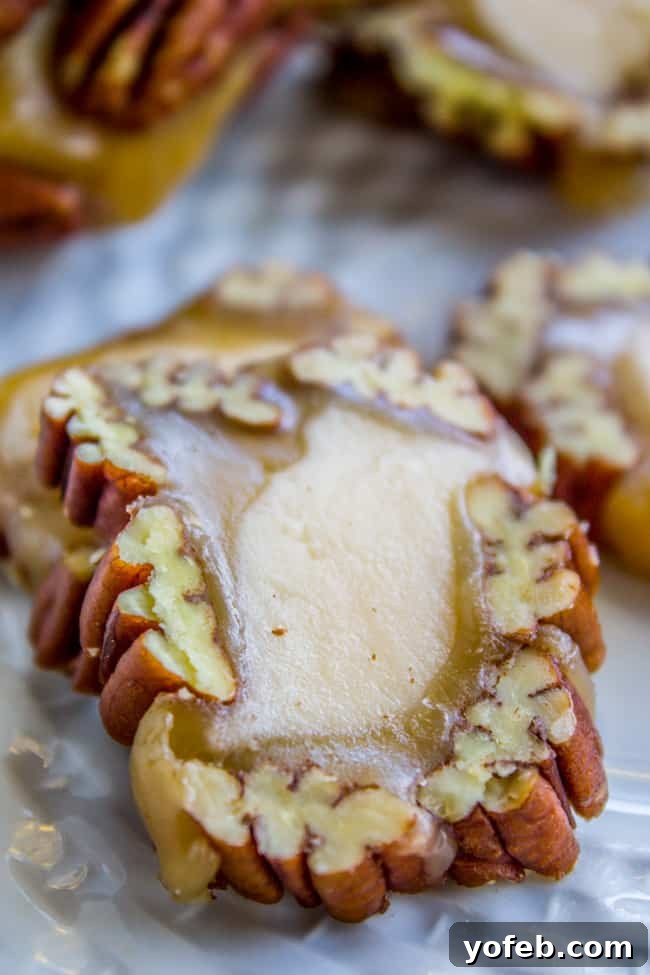 Gourmet Caramel Pecan Nougat Rolls 5 Hand holding a slice of a freshly made Caramel Pecan Roll
