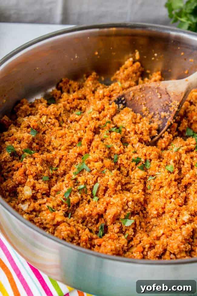 Spanish Cauliflower Rice for Your Mexican Feast 9 Close up of a spoonful of Spanish Cauliflower Rice, showcasing texture and color