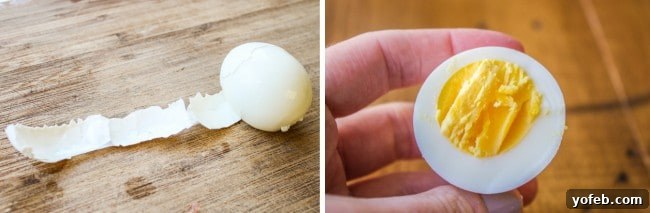 Timeless Deviled Eggs 6 A perfectly peeled hard-boiled egg alongside another cut in half, showcasing a vibrant, well-cooked yolk without any green ring.