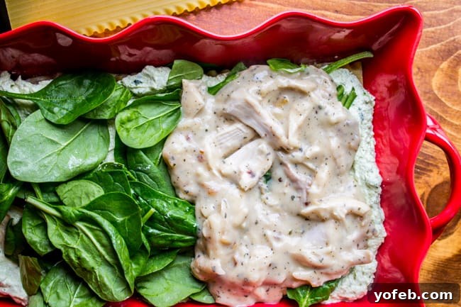 Creamy Chicken Pesto Lasagna 9 Serving a generous portion of White Lasagna with Chicken and Pesto