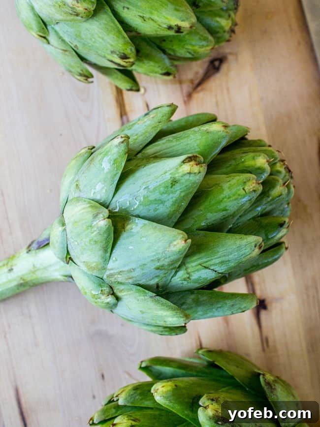 Garlic-Kissed Roasted Artichokes with Zesty Pesto 3 Garlic Roasted Artichokes with Pesto Dipping Sauce from The Food Charlatan - spread