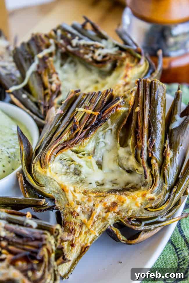 Garlic-Kissed Roasted Artichokes with Zesty Pesto 4 Garlic Roasted Artichokes with Pesto Dipping Sauce from The Food Charlatan - finished dish
