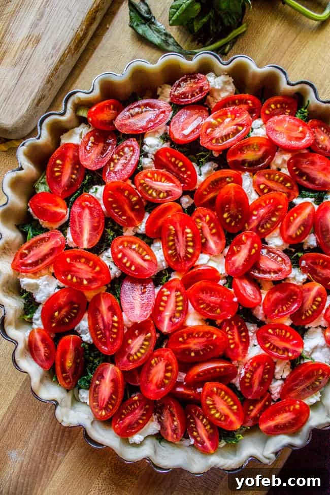 Farmers Market Quiche with Cherry Tomatoes Leeks and Spinach 4 Fresh ingredients for Cherry Tomato, Leek, and Spinach Quiche on a cutting board.