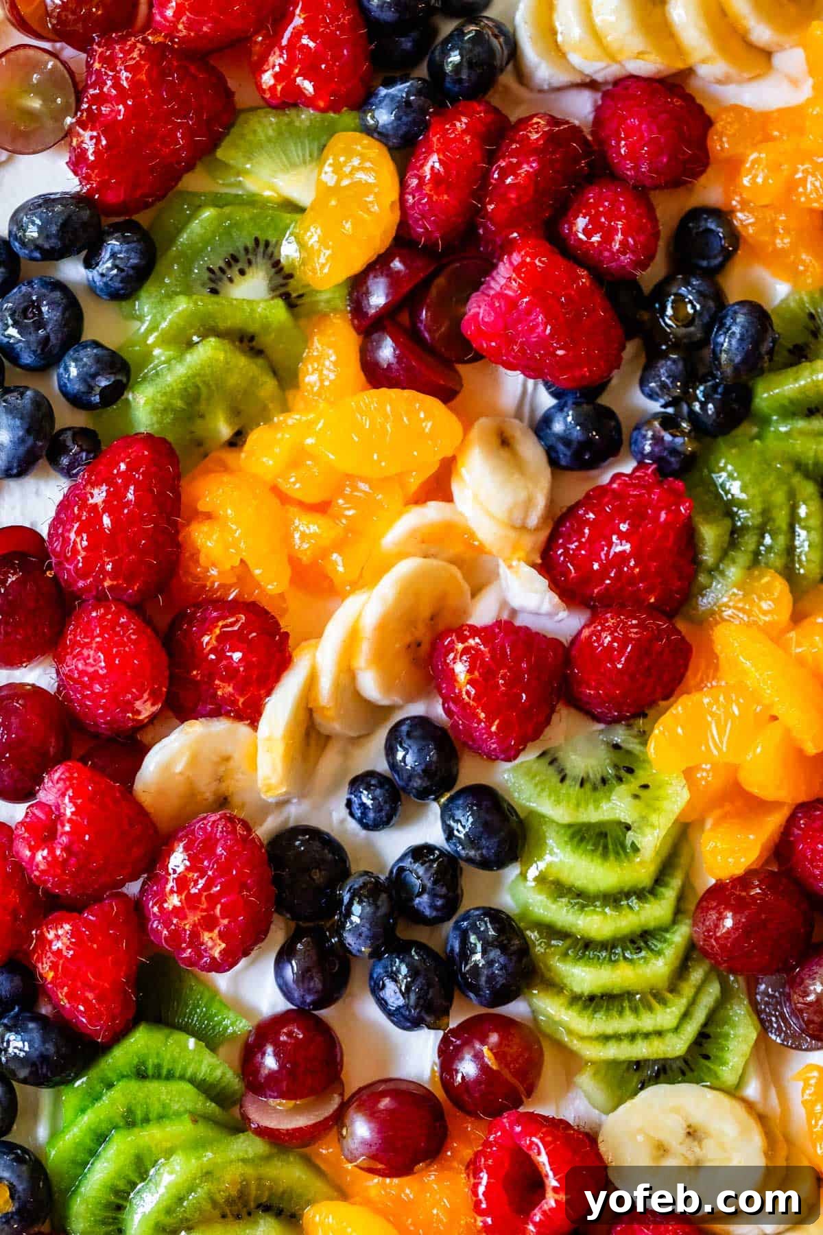 Pillowy Sugar Cookie Fruit Pizza Delight 25 An overhead shot of a rectangular fruit pizza, with different fruits arranged in appealing groupings, rather than traditional concentric circles.