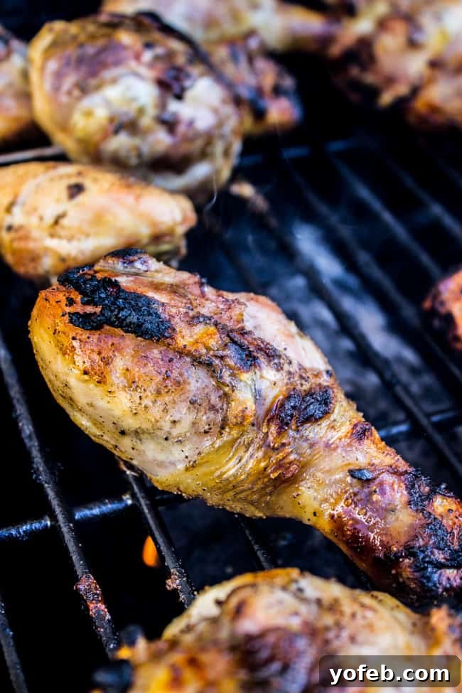 Bright Lemon Tarragon Grilled Chicken 7 Grilled chicken drumsticks and thighs coated in lemon tarragon sauce, ready to serve.