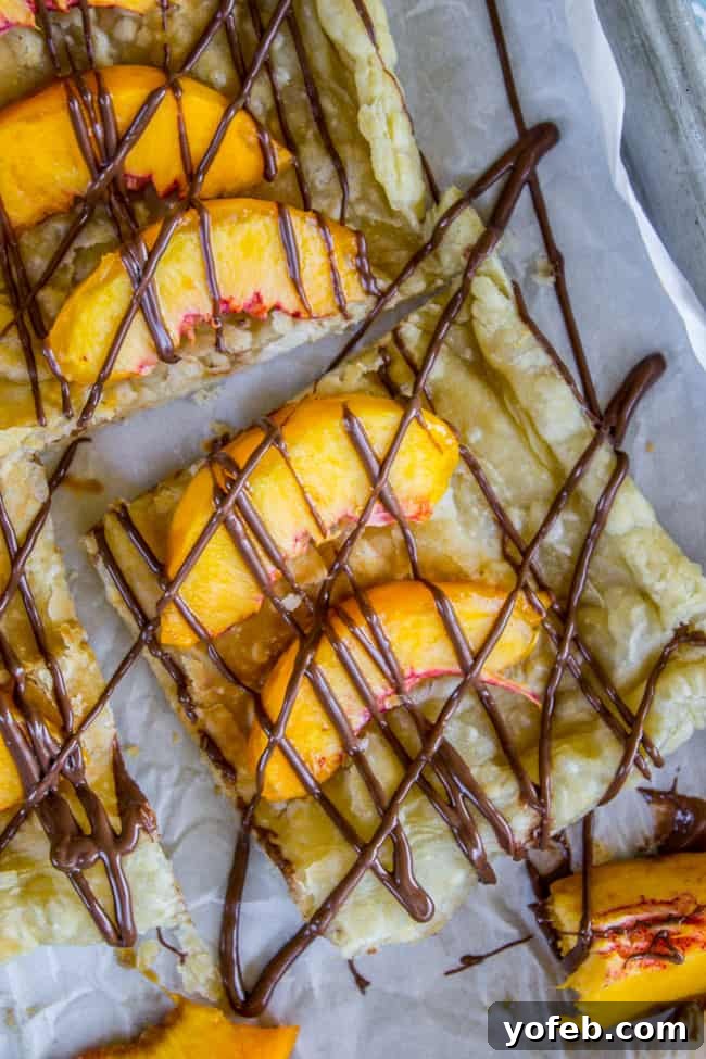 Peachy Nutella Pockets 10 A close-up of the finished Peach and Nutella Pastry Puffs, glistening with Nutella.