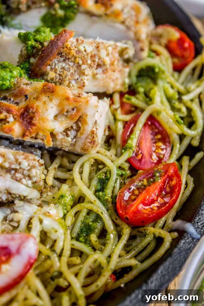 Golden Almond Chicken and Zesty Pesto Pasta 4 Close-up of Almond-Crusted Chicken with Melted Cheese