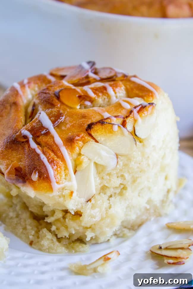 Golden Hour Almond Swirls 3 A single honey almond roll with a golden crunchy topping and a glistening sweet almond glaze.