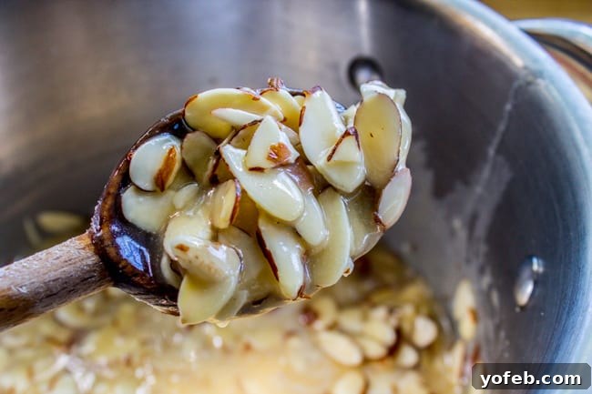 Golden Hour Almond Swirls 6 Cooking crunchy honey almond topping in a saucepan.