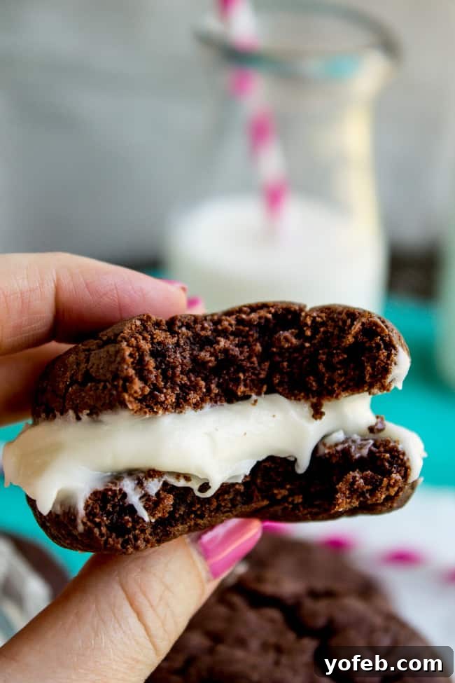 Homemade Cake Mix Oreos with Cream Cheese Filling 4 Close-up of a stack of Homemade Oreos, showing the tender cookie and creamy frosting