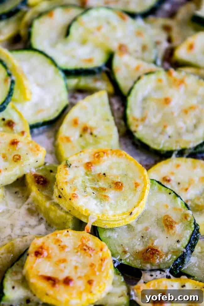 Golden Parmesan Zucchini Bake 4 Baked parmesan zucchini and yellow squash on a pan.