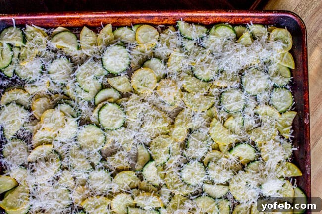 Golden Parmesan Zucchini Bake 5 Parmesan, zucchini, and squash on a pan.