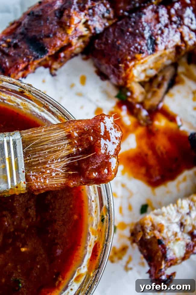 Nana's Irresistible Fall-Off-The-Bone Ribs with Barb's Signature Barbecue Sauce 6 A close-up shot of Nana's homemade Barb-ecue sauce, rich and ready to be brushed on the slow-roasted ribs