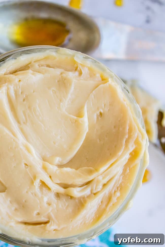Quick Whipped Maple Butter 2 A glass jar filled with golden maple butter, ready to be spread on toast.