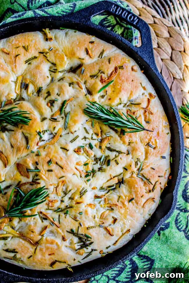 Sizzling Skillet Rosemary Garlic Bread 2 Garlic and Rosemary Skillet Bread, freshly baked with a golden-brown crispy crust and aromatic herbs.
