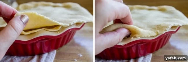 Comforting Classic Chicken Pot Pie 4 Hands carefully placing a top crust over a filled chicken pot pie.