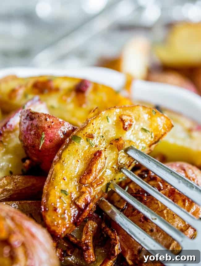 Onion Soup Mix Roasted Potatoes A bowl of roasted potatoes and onions, glistening with oil and seasoning, ready to be served as a festive side.