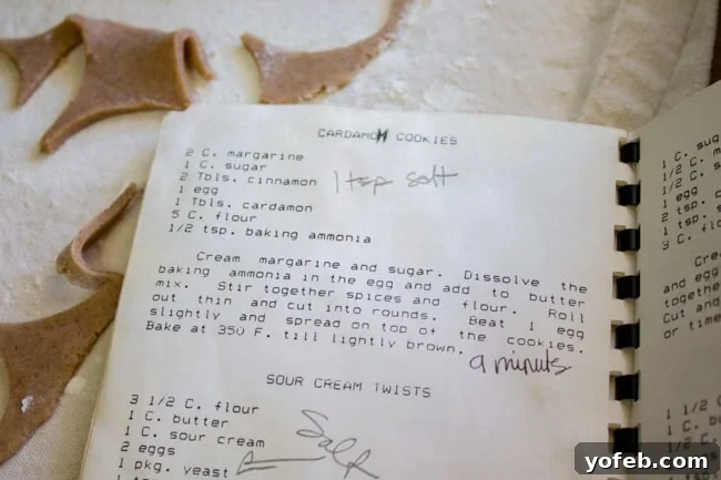 Swedish Cardamom Crisp Cookies 6 An open, old family recipe book, showing handwritten instructions for a traditional recipe.