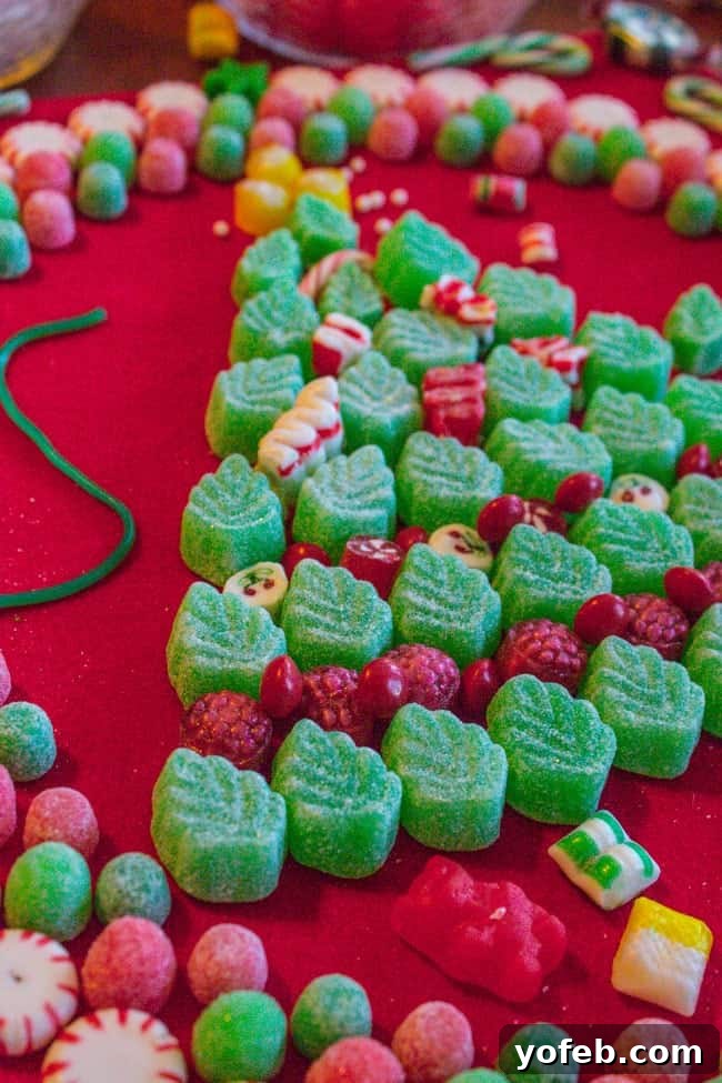 Candy Christmas Tree Craft from The Food Charlatan. Learn how to make your own Candy Christmas Tree craft to deck the halls this year! Get some felt and burlap and a TON of old fashioned candy and start glueing away. My mother-in-law still has the one she made 30 years ago! #christmas #tree #candy #oldfashioned #homemade #christmastree #holidays #candycrafts Assembling the Main Candy Christmas Tree Structure