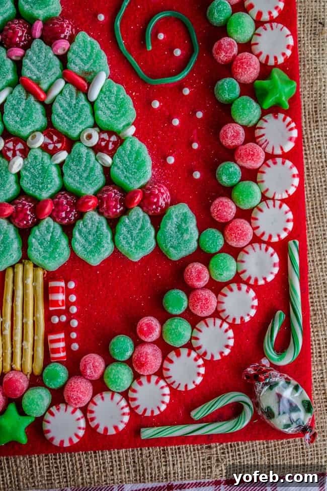 Candy Christmas Tree Craft from The Food Charlatan. Learn how to make your own Candy Christmas Tree craft to deck the halls this year! Get some felt and burlap and a TON of old fashioned candy and start glueing away. My mother-in-law still has the one she made 30 years ago! #christmas #tree #candy #oldfashioned #homemade #christmastree #holidays #candycrafts Completed Candy Christmas Tree Craft Drying