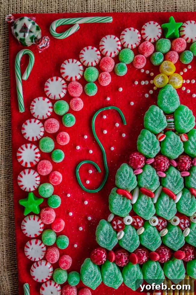 Handmade Candy Christmas Tree Craft with Burlap Background. Learn how to make your own Candy Christmas Tree craft to deck the halls this year! Get some felt and burlap and a TON of old fashioned candy and start glueing away. My mother-in-law still has the one she made 30 years ago! #christmas #tree #candy #oldfashioned #homemade #christmastree #holidays #candycrafts Handmade Candy Christmas Tree Craft with Burlap Background