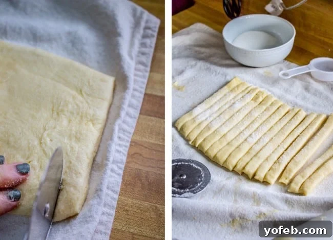 Swedish Layered Sour Cream Twists 13 strips of cookie dough dusted with sugar, laid out on a pastry cloth.