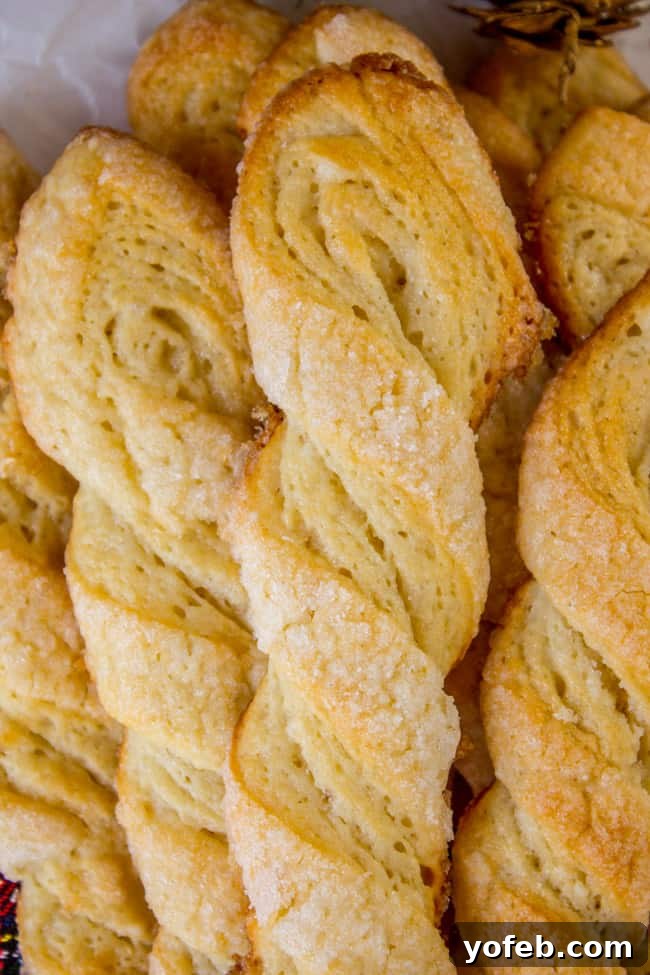 Swedish Layered Sour Cream Twists 5 Swedish sour cream twisted cookies, showcasing their unique twisted shape.