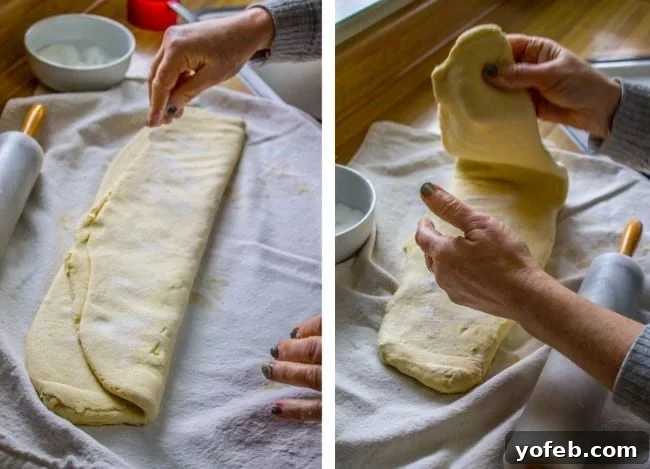Swedish Layered Sour Cream Twists 10 dough being folded into a log shape, preparing for the next roll.