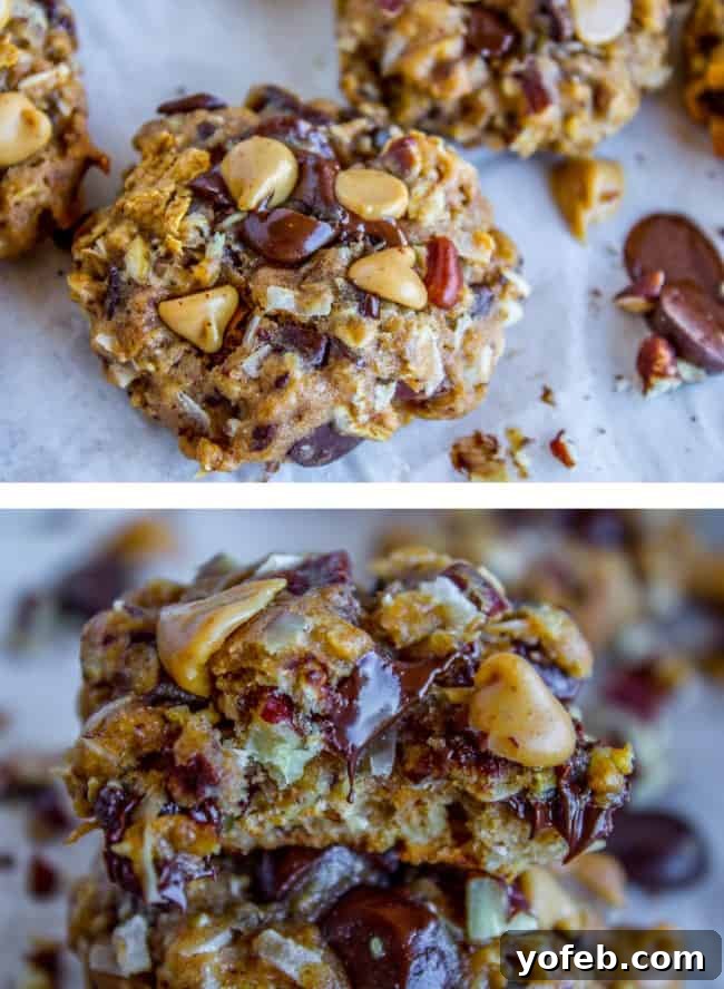 Skinny Texas Cowboy Cookies by The Food Charlatan. These low calorie cookies have NO sugar, NO white flour, and only 2 tablespoons of butter in the whole batch! What they do have are a ton of mix-ins. Oatmeal, coconut, bran flakes, pecans to name a few. They taste like a Texas Cowboy Cookie, but way better for you! (Which means I can eat half a batch...right?) #skinny #texascowboycookies #healthy #cookies #lowcalorie #nosugar #noflour #lowcarb #easy #recipes Raw, rolled healthy cowboy cookie dough balls on a baking sheet, ready for the oven.