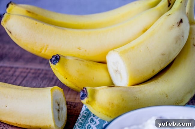 Efficiently cutting bananas for recipes to prevent browning and waste. Bananas sliced in half for meal prep