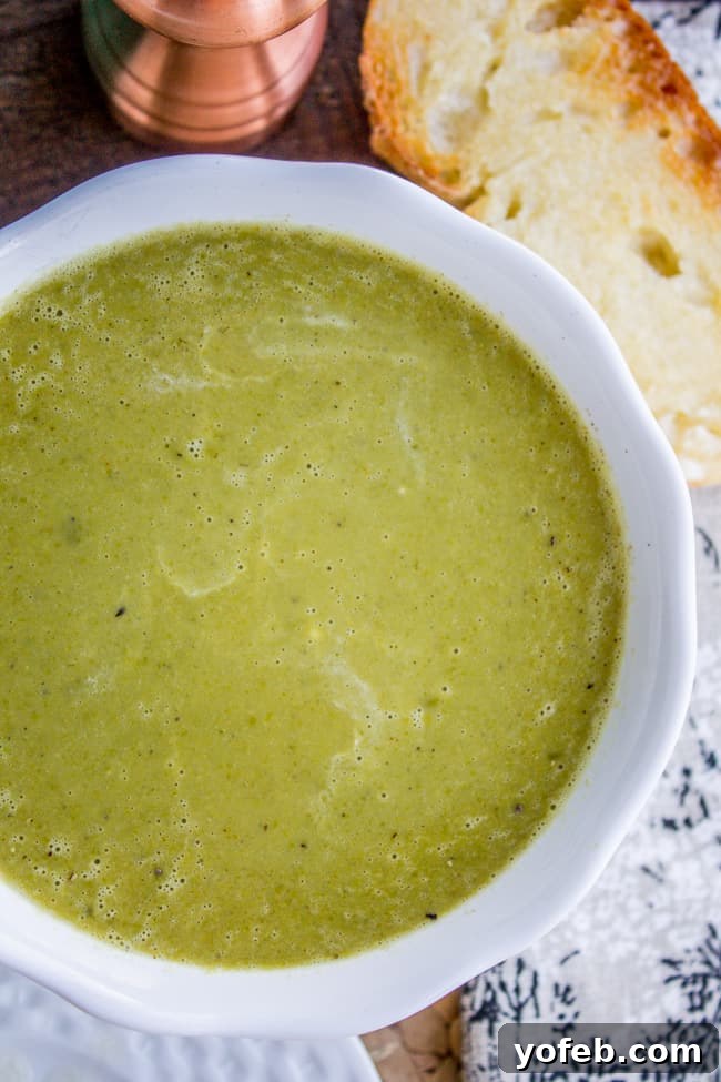 Vibrant 30-Minute Pea Soup 2 A vibrant bowl of creamy frozen pea soup, garnished with fresh herbs and a swirl of cream, ready to be enjoyed.