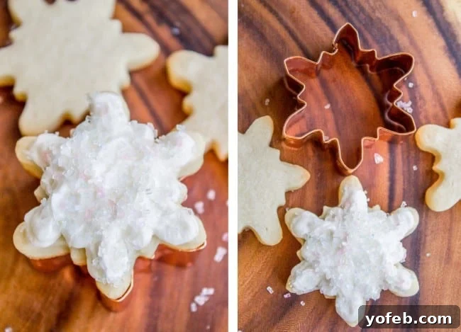 The Softest Sugar Cookies of Your Life from The Food Charlatan. A secret ingredient in this sugar cookies recipe makes these cookies the SOFTEST and most flavorful cookies of your life! And they even hold their shape after baking, so you get exactly what you want instead of sad blob cookies. #sugarcookies #cookies #frosting #soft #recipe #holiday #christmas #easter #halloween #fourthofjuly #stpatricksday #cookies #easy white-frosted snowflake cookies next to a metal cookie cut out.