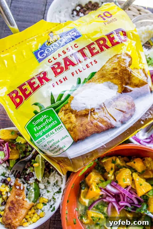 Crispy Beer-Battered Fish Burrito Bowl with Sunshine Avocado Salsa 9 Fresh cilantro and lime slices, perfect garnishes for a Mexican-inspired fish dish
