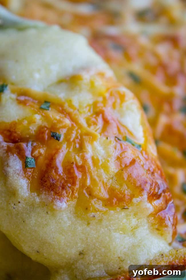 Ultimate Make Ahead Mashed Potatoes from Ina Garten 3 Close up view of the rich, cheesy topping on prepared mashed potatoes.