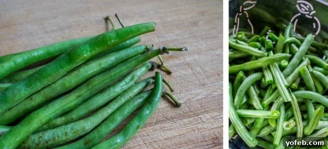 Fresh green beans laid out on a cutting board, ready for trimming.