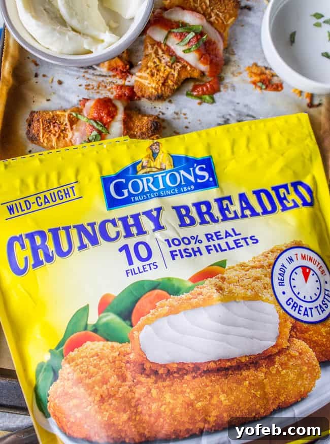 Crispy Fish Parmesan The Seafood Classic 7 A bag of Gorton's crispy fish sticks alongside baked fish sticks on a baking sheet, with a bowl of fresh mozzarella slices and a fish stick ready for assembly, topped with cheese, sauce, and basil.