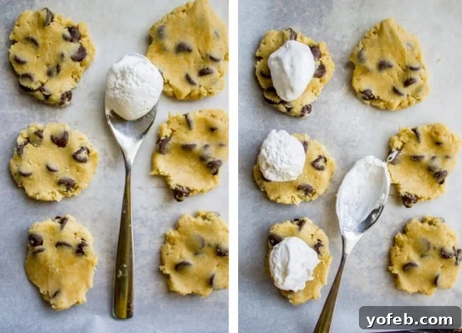 Gooey Marshmallow Creme Filled Chocolate Chip Cookies 9 A small spoon scooping marshmallow creme onto a cookie dough disc.