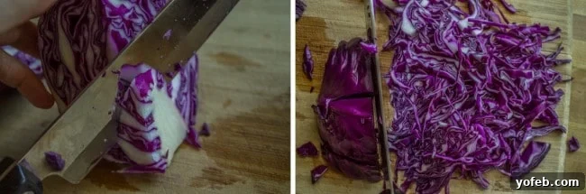 Zesty Lemon Herb Coleslaw 8 A purple cabbage being expertly sliced into thin shreds on a wooden cutting board, demonstrating preparation for colorful coleslaw.