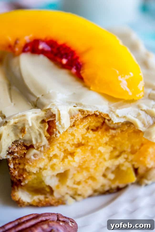Velvet Peach Brown Sugar Dream 12 A side view of a sliced peach cake, highlighting the chewy, slightly browned edge that is a signature of this recipe.