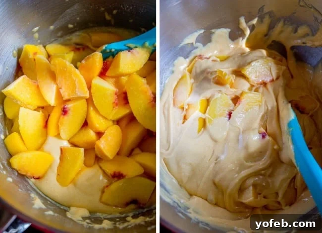 Velvet Peach Brown Sugar Dream 7 A large mixing bowl containing golden cake batter with frozen peach pieces being mixed in with a sturdy wooden spoon.