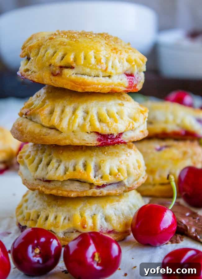 Handheld Chocolate Cherry Delights 4 A row of delicious Chocolate Cherry Hand Pies on a baking sheet