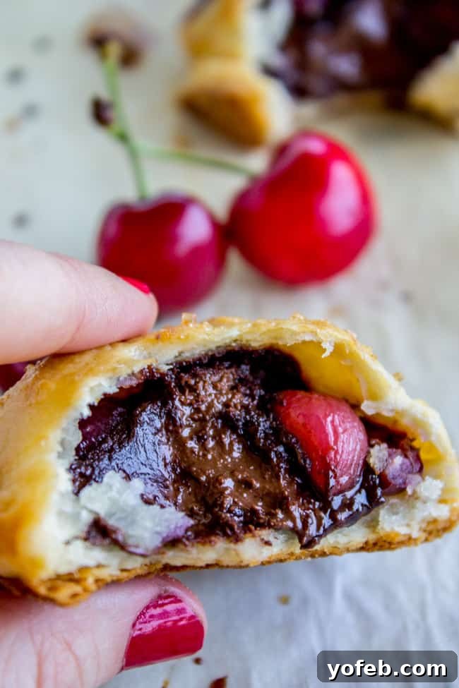Handheld Chocolate Cherry Delights 5 Golden brown Chocolate Cherry Hand Pies cooling on a wire rack