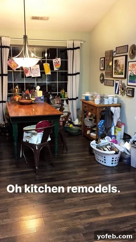 Home remodel in progress, showing kitchen cabinets and floors.